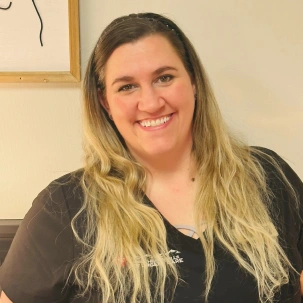 Rachel M., LVT, providing attentive veterinary care for pets.